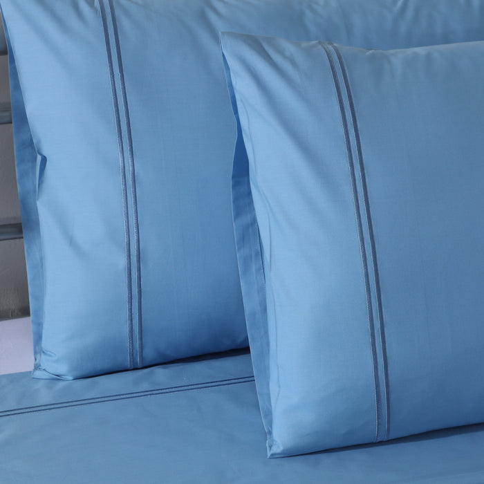 Organic cotton colored sheet set in blue mirage with 250 thread count from Whites of London NZ, featuring a soft, vibrant bed linen design.
