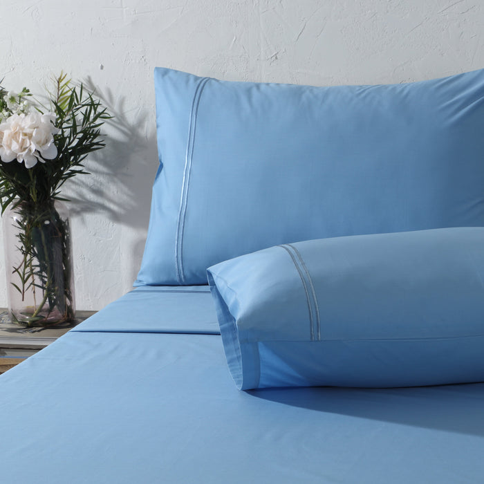Organic cotton coloured sheet set in blue mirage with 250 thread count, featuring a soft, smooth fabric and vibrant blue design.