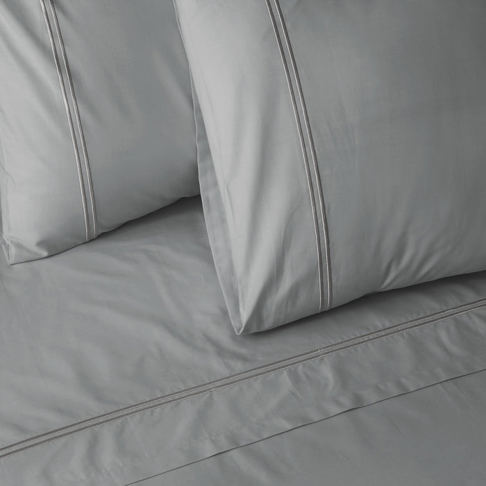 Organic cotton coloured sheet set in greystone with 250 thread count, featuring soft, smooth fabric from Whites of London NZ.