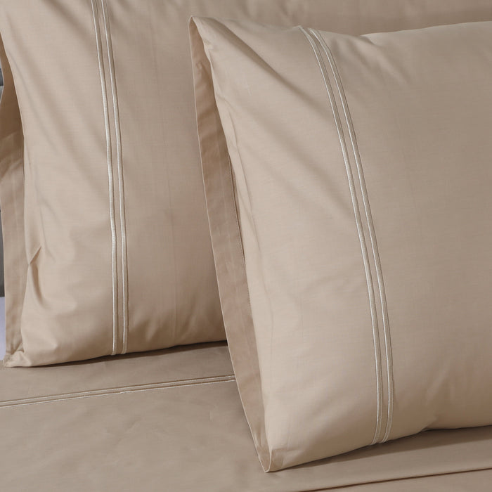 Organic cotton coloured sheet set in humus tone with 250 thread count from Whites of London NZ, featuring neatly folded bedding.