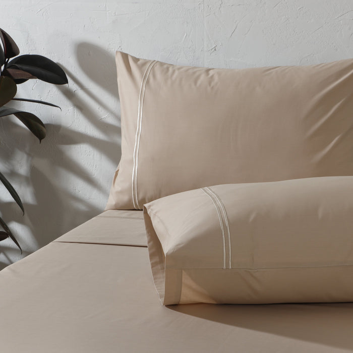 Organic cotton coloured sheet set in humus, 250 thread count, by Whites of London NZ, with neatly folded sheets and pillowcases.