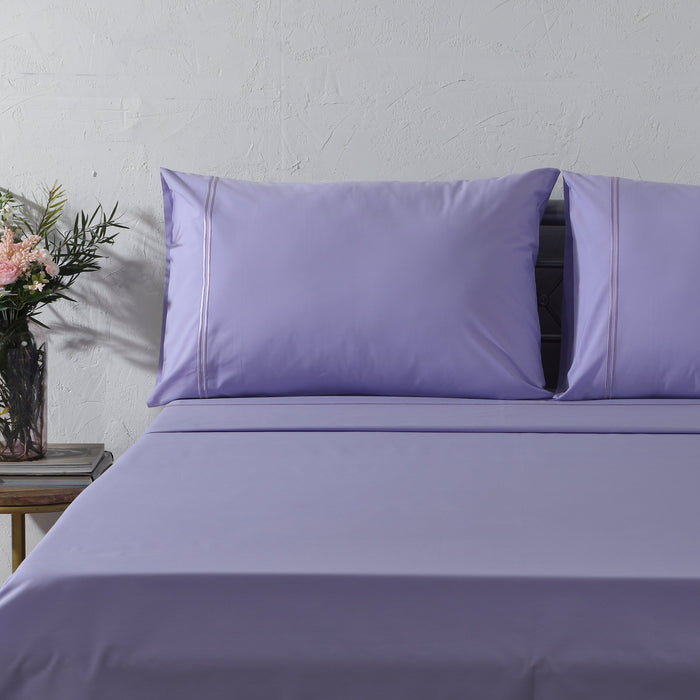 Organic cotton lavender mist sheet set with colored 250 thread count for a soft, cozy bed linen look.