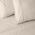 Organic cotton coloured sheet set in peach fuzz with 250 thread count, featuring soft, smooth fabric and a cozy, inviting look.
