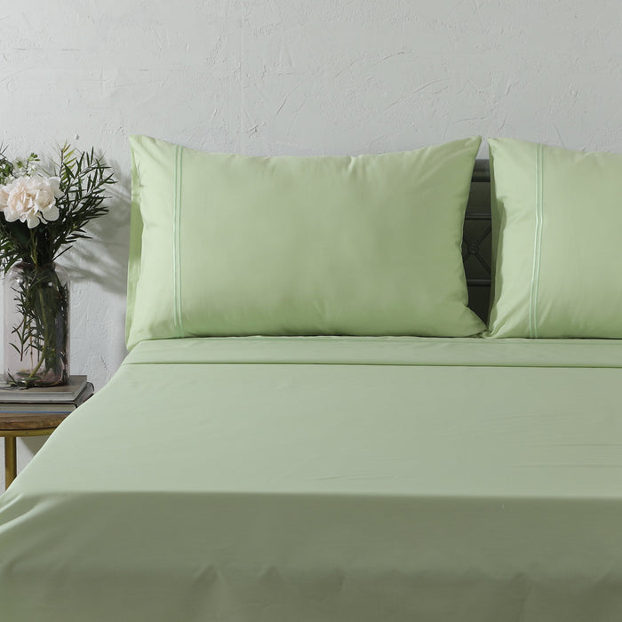 Organic cotton coloured sheet set in reef blue with 250 thread count, featuring fitted and flat sheets from Whites of London NZ.