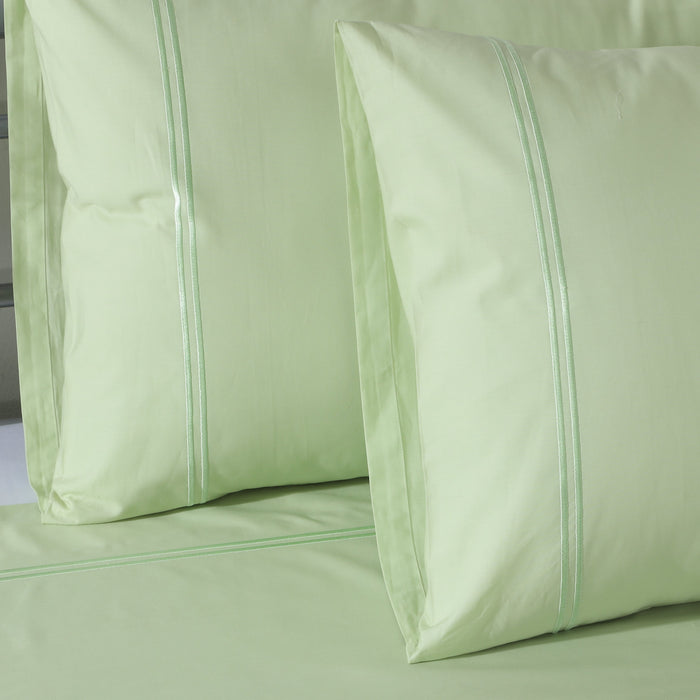 Organic cotton coloured sheet set in reef blue with 250 thread count, including fitted and flat sheets from Whites of London NZ.
