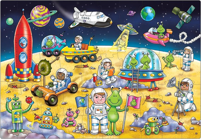 Colorful cartoon jigsaw puzzle featuring astronauts, green aliens, robots, and rockets on a lunar surface.