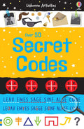 Bright yellow book cover with blue lettering, red code wheels, and spy-themed illustrations like sunglasses and keys.