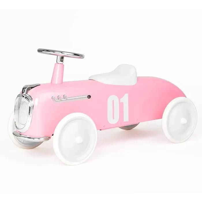 Retro pink ride-on car with white wheels, a white seat, silver steering wheel, and white number 01 on the side.