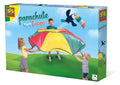 SES box showing children using a colorful parachute to toss a plush toucan toy into the air.