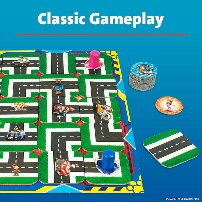 A road maze game board with Paw Patrol characters, pink and blue player pieces, and round tokens on a blue background.