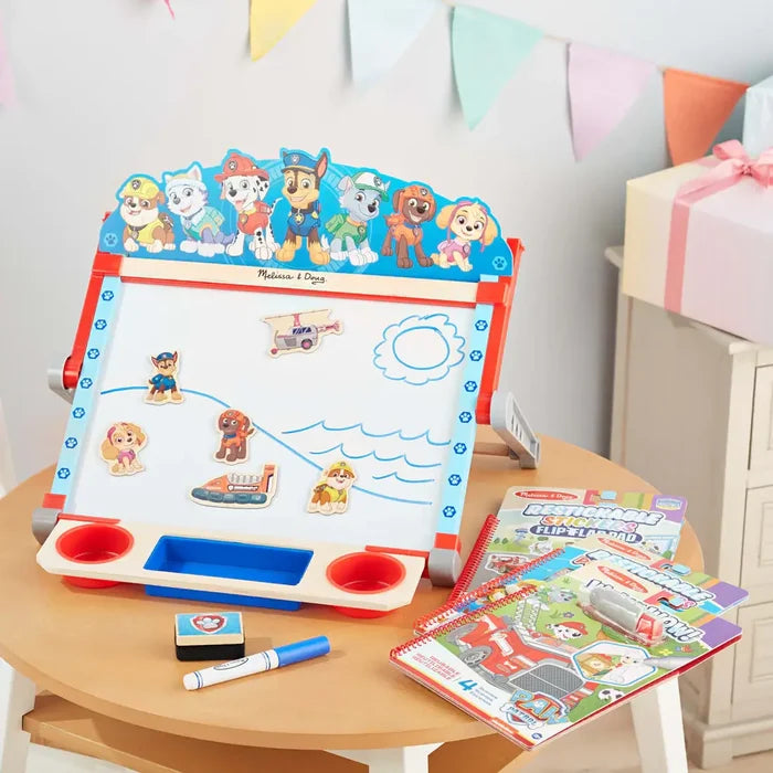 PAW Patrol tabletop wooden easel with a dry-erase board, magnetic character pieces, sticker pads, and a blue marker.