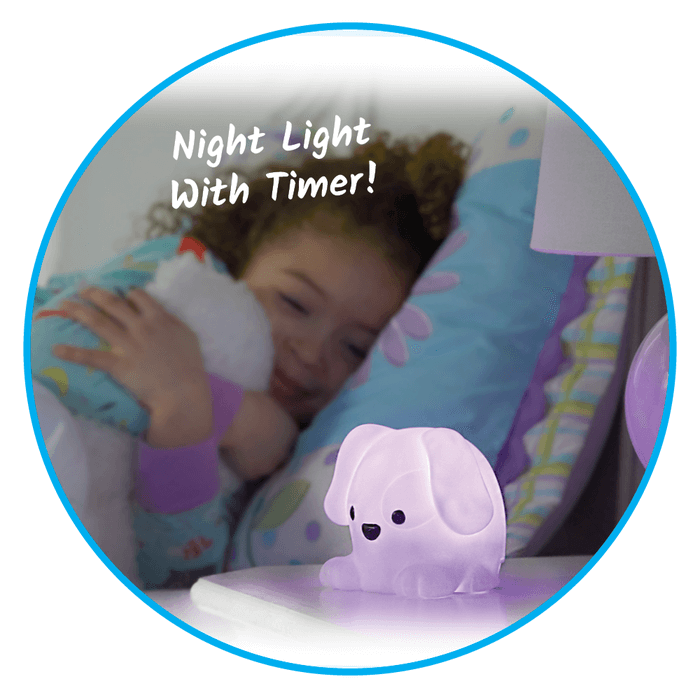 Glowing purple puppy night light on a bedside table with a smiling child hugging a plush toy in bed.