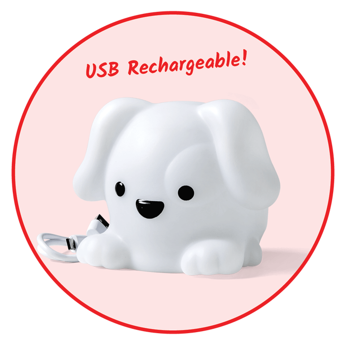 White puppy-shaped night light with black facial features, a USB cable, and red text reading USB Rechargeable.