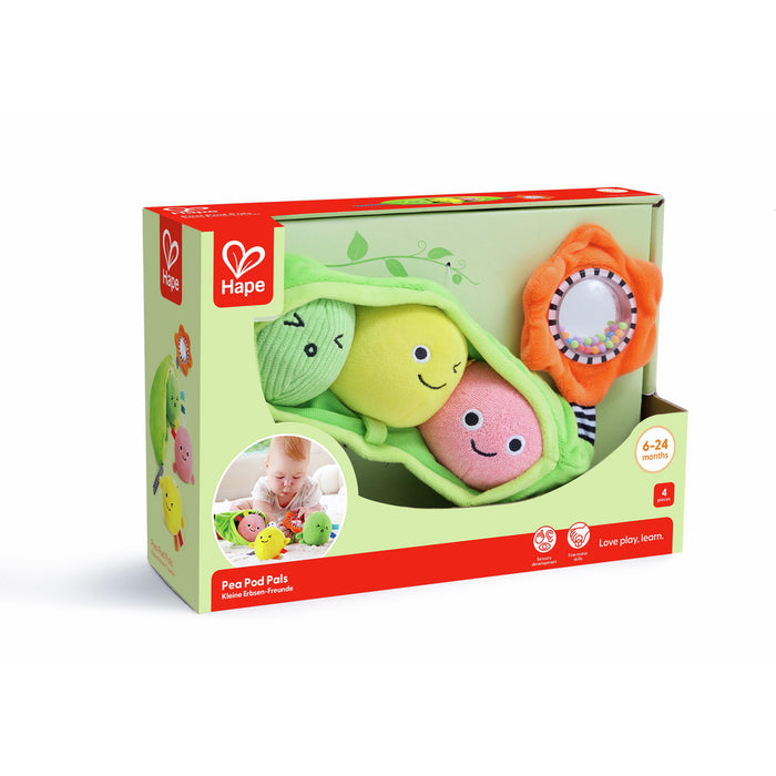 Hape box with three colorful, smiling plush peas in a green pod and an orange flower-shaped rattle.
