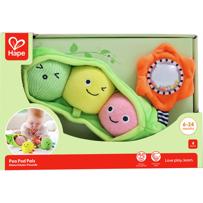 Soft green pea pod toy with three colorful smiling peas and an orange flower rattle in its green and red box.