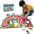 Child assembling a barn-shaped floor puzzle with farm animal pieces next to its blue and yellow storage box.