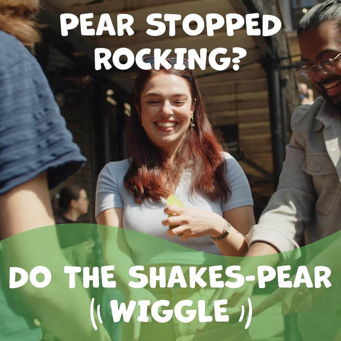 Three people laughing outdoors while playing with a green pear toy. Text says: Do the Shakes-pear (Wiggle).