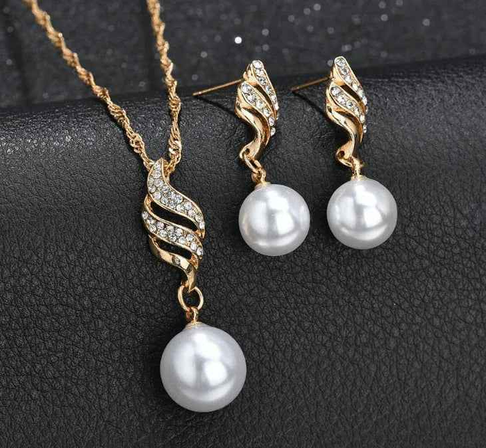 Stylish 3Sixty5 pearl jewelry gift set featuring a necklace, bracelet, and earrings with golden pearls, elegant jewelry display