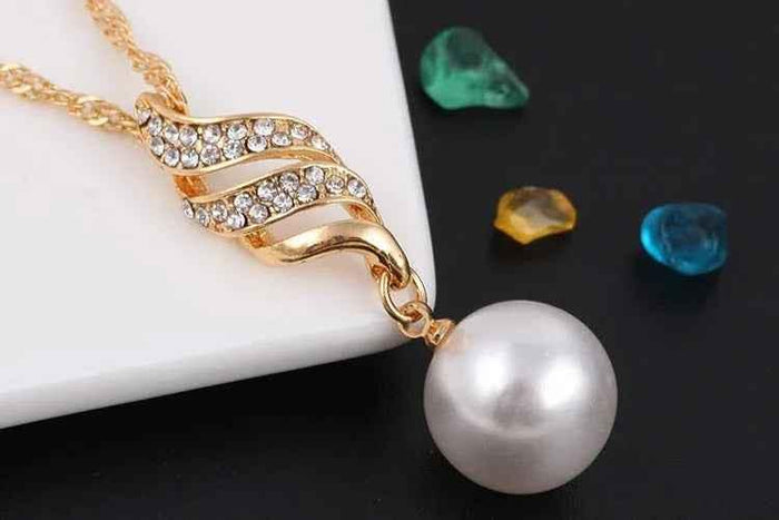 Stylish 3Sixty5 pearl jewelry gift set with elegant gold pearl necklace and matching earrings, perfect for special occasions.