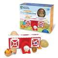 Red toy barn with numbered doors and colorful chicks in eggshells, shown beside its blue Learning Resources packaging.