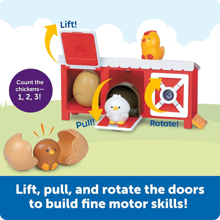 Red toy chicken coop with interactive doors, rotating dial, and colorful chicks to build fine motor skills.