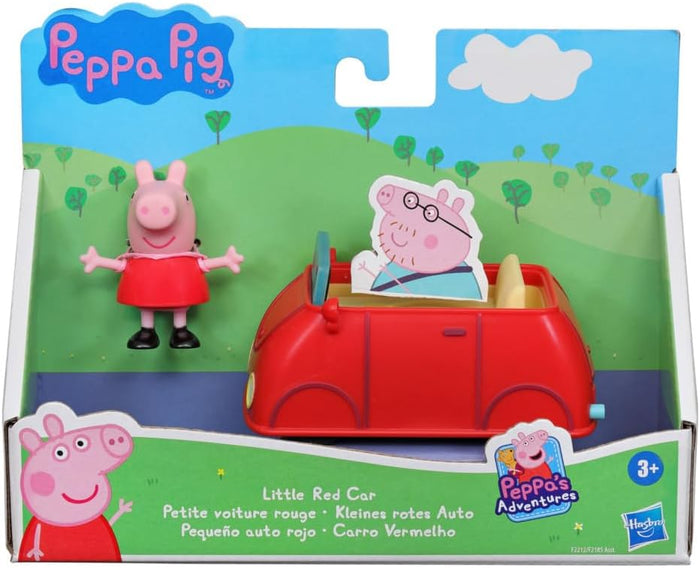 Peppa Pig figure and red toy car in a themed display box with a green hill background and Daddy Pig cutout.