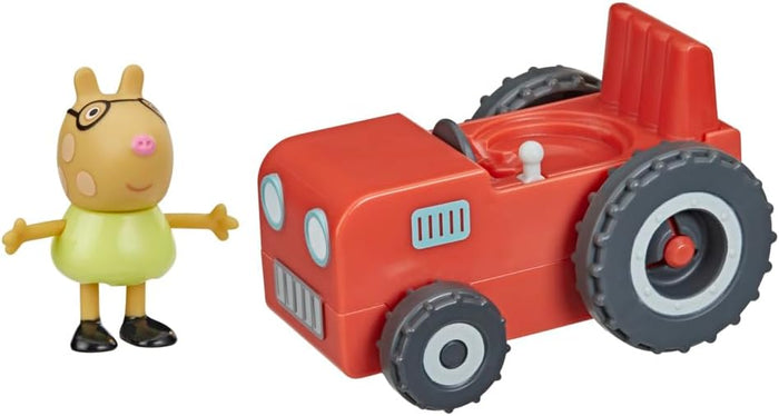 Red toy tractor with grey wheels beside a Pedro Pony figure wearing glasses and a light green shirt.