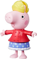 Peppa Pig toy figure wearing a yellow hat, red buttoned coat, and blue polka-dot skirt with white ruffled trim.