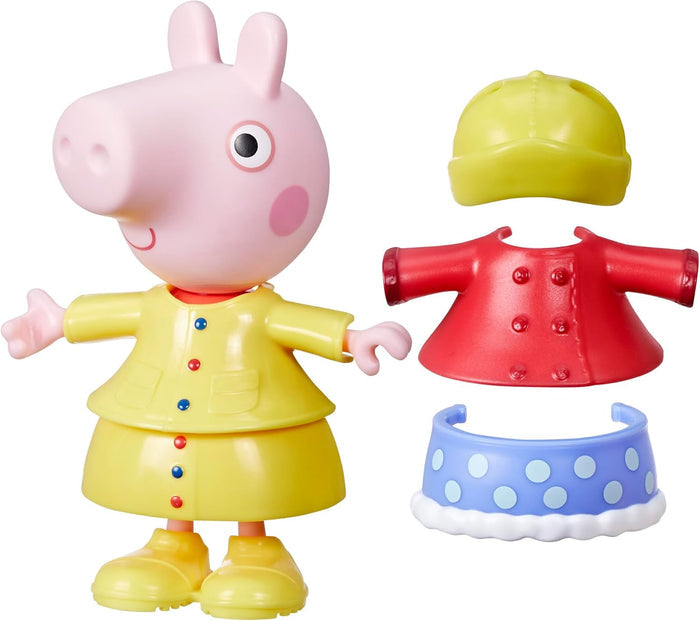 Pink Peppa Pig toy in a yellow raincoat and boots with a red coat, yellow hat, and blue polka-dot skirt accessory.