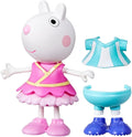 Suzy Sheep toy in pink ballerina dress with extra blue and white striped top, blue shorts, and blue shoes.