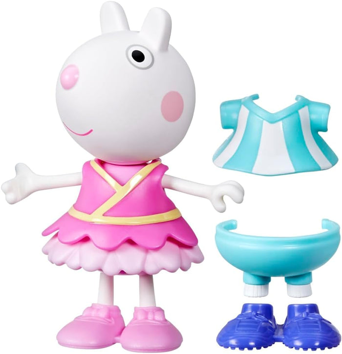 Suzy Sheep toy in pink ballerina dress with extra blue and white striped top, blue shorts, and blue shoes.