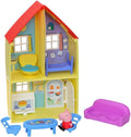 Two-story yellow toy house with red roof, interior rooms, blue furniture, purple sofa, and a pink pig figurine.