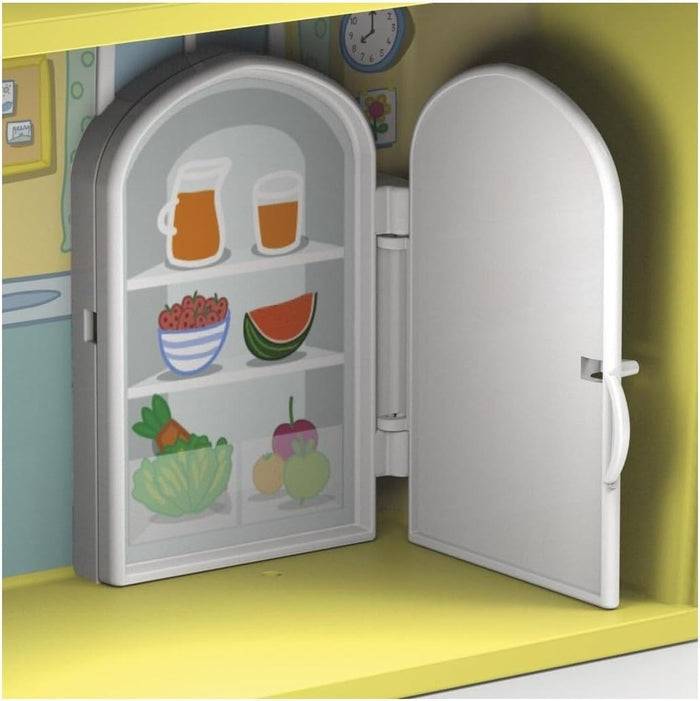 Open white and grey toy refrigerator with arched door, showing stickers of juice, fruit, and vegetables.