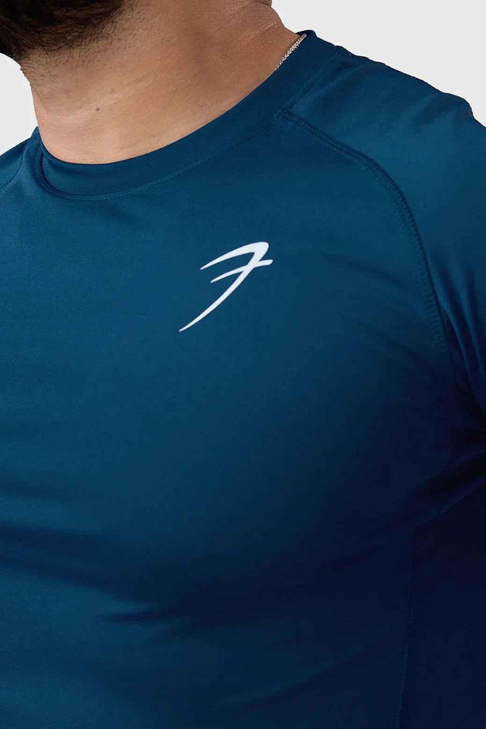 Fuaark Nz teal performance T-shirt for men, casual fit, soft fabric, featuring the brand logo on the front.