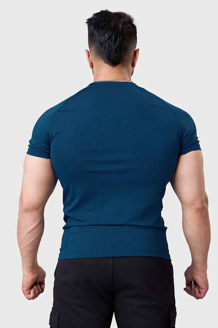 Fuaark Nz teal performance T-shirt with crew neck and short sleeves, made from breathable fabric, displayed on a flat surface.