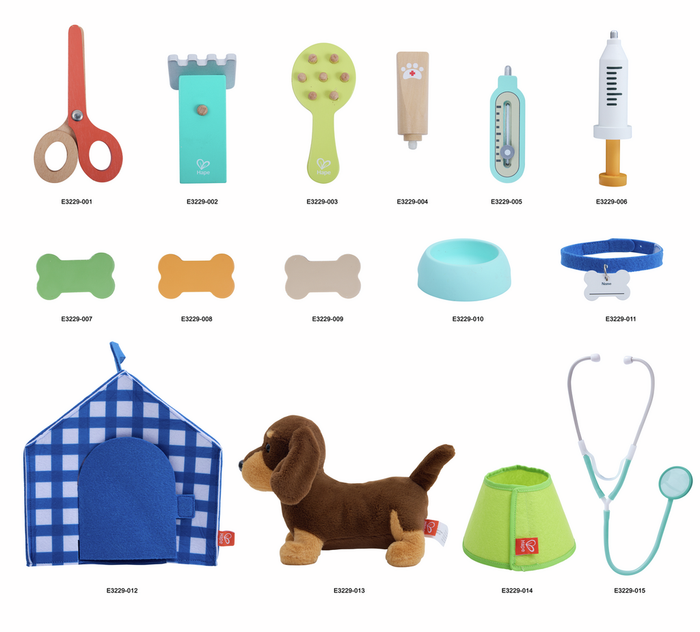 Toy vet playset with plush dog, blue checkered carrier, wooden medical tools, stethoscope, and pet care accessories.