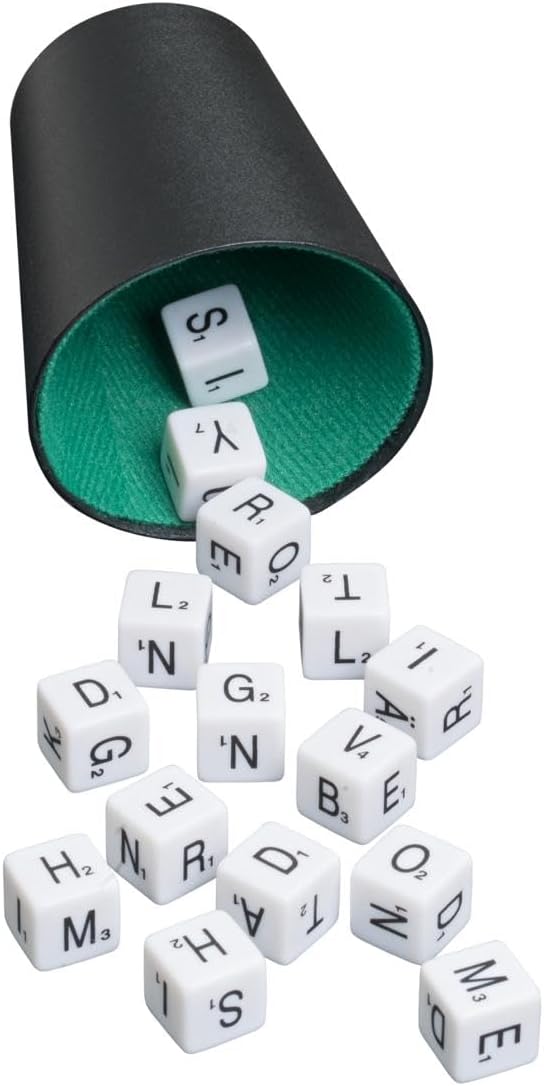 White letter dice spill out from a black dice cup with a green felt lining onto a white surface.