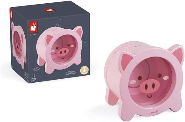 Pastel pink pig moneybox with a transparent face window and coin slot, shown next to its dark blue product box.