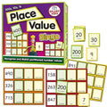 Purple bingo box with colorful grid boards and numbered cards showing place values for hundreds, tens, and ones.