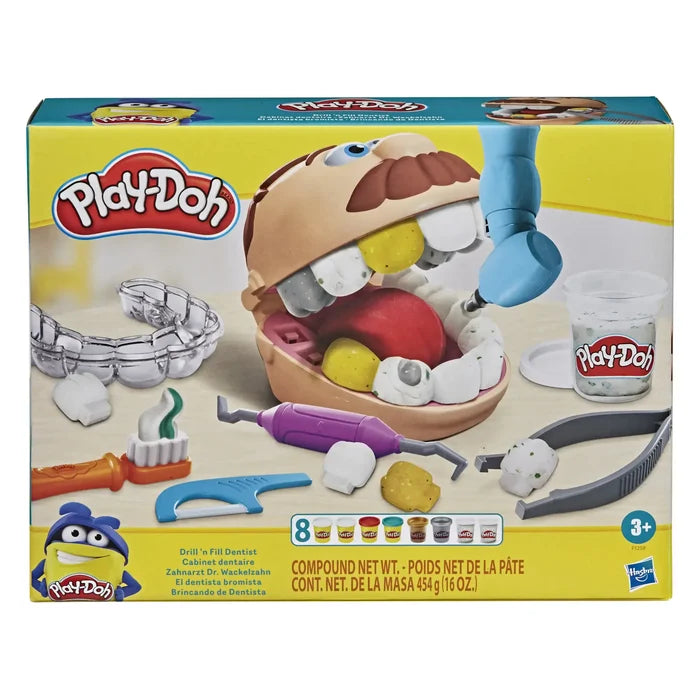 Yellow toy box featuring a tan head with an open mouth, clay teeth, blue drill, and various plastic dental tools.