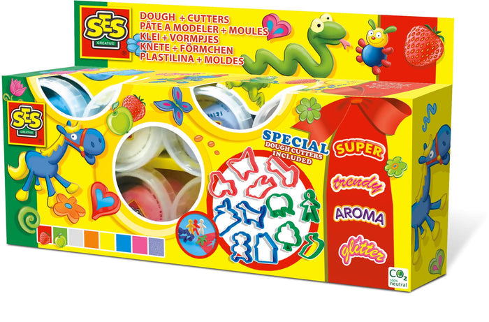 Yellow SES dough box with animal illustrations, windows showing dough tubs, and assorted colorful plastic cutters.