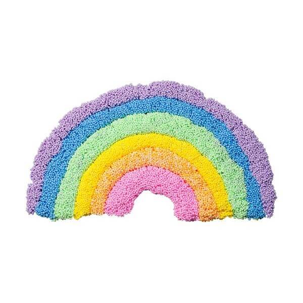 Rainbow made from textured foam beads in layers of purple, blue, green, yellow, orange, and pink.