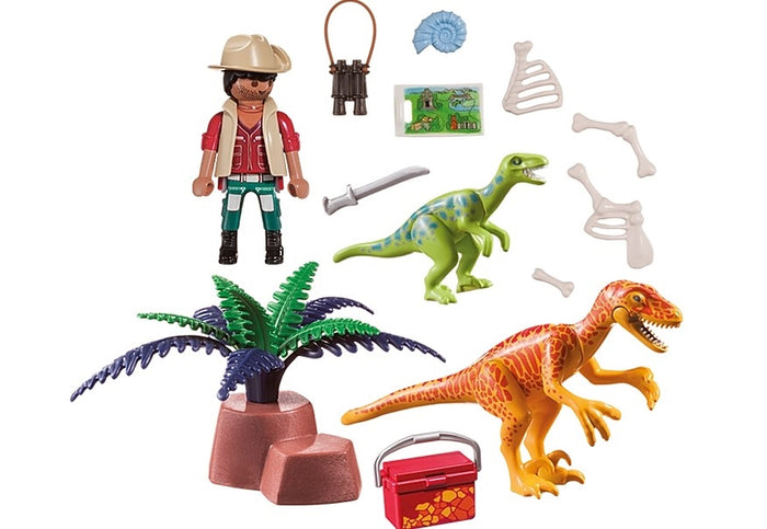 Playmobil explorer set with green and orange dinosaurs, researcher figure, tropical plant, bones, and gear.