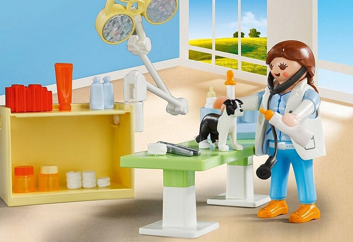 Playmobil veterinarian examining a black and white dog on a green table with medical supplies and exam light.