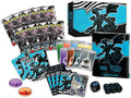 Black and blue dragon-themed card set with storage box, booster packs, sleeves, energy cards, and game dice.