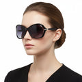 Black dealonlinenz sunglasses with polarized lenses and rhinestone embellishments, stylish and reflective for sun protection.