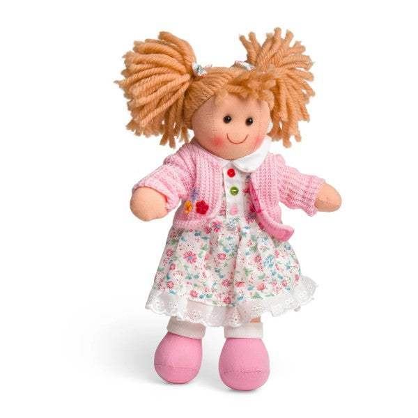 Soft cloth doll with orange yarn pigtails, a pink knitted cardigan, floral print dress, and pink shoes.