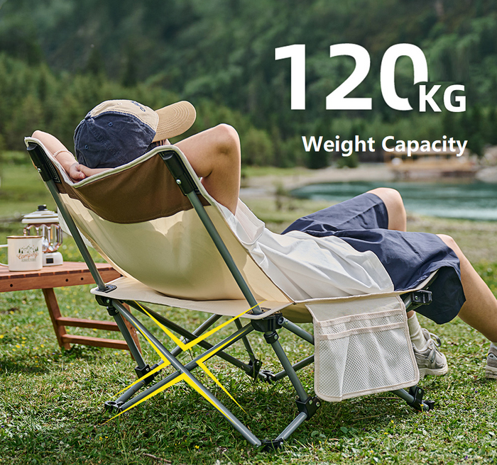Black ECOTREK portable folding beach chair with enhanced size and comfort, shown folded and ready for outdoor use.