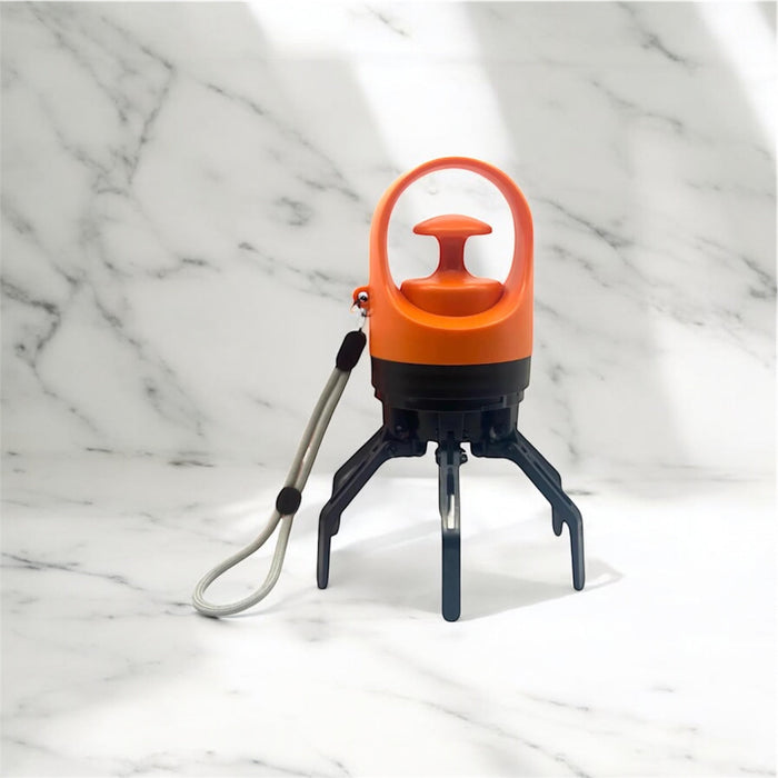 Portable pooper scooper from DogTreatNZ with a compact design and ergonomic handle, ideal for easy dog waste cleanup.