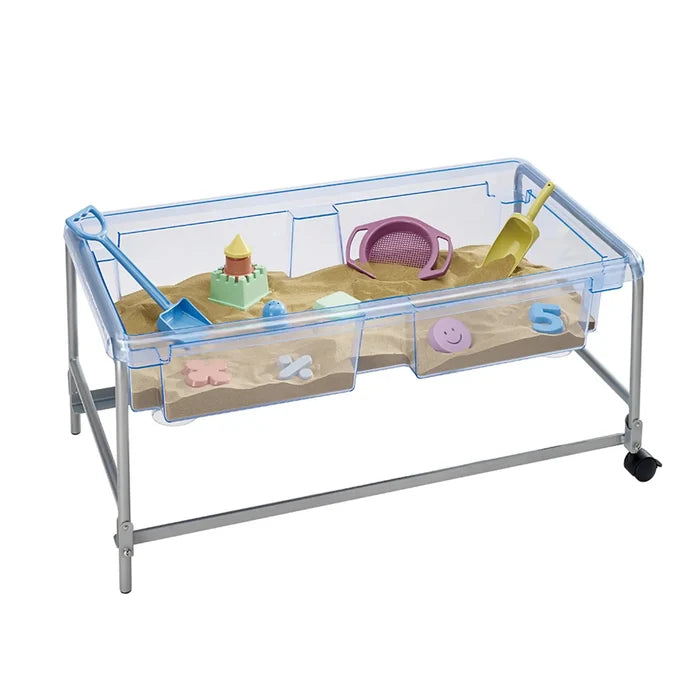 Clear blue plastic tray on a silver metal frame with wheels, filled with sand and various colorful sand toys.